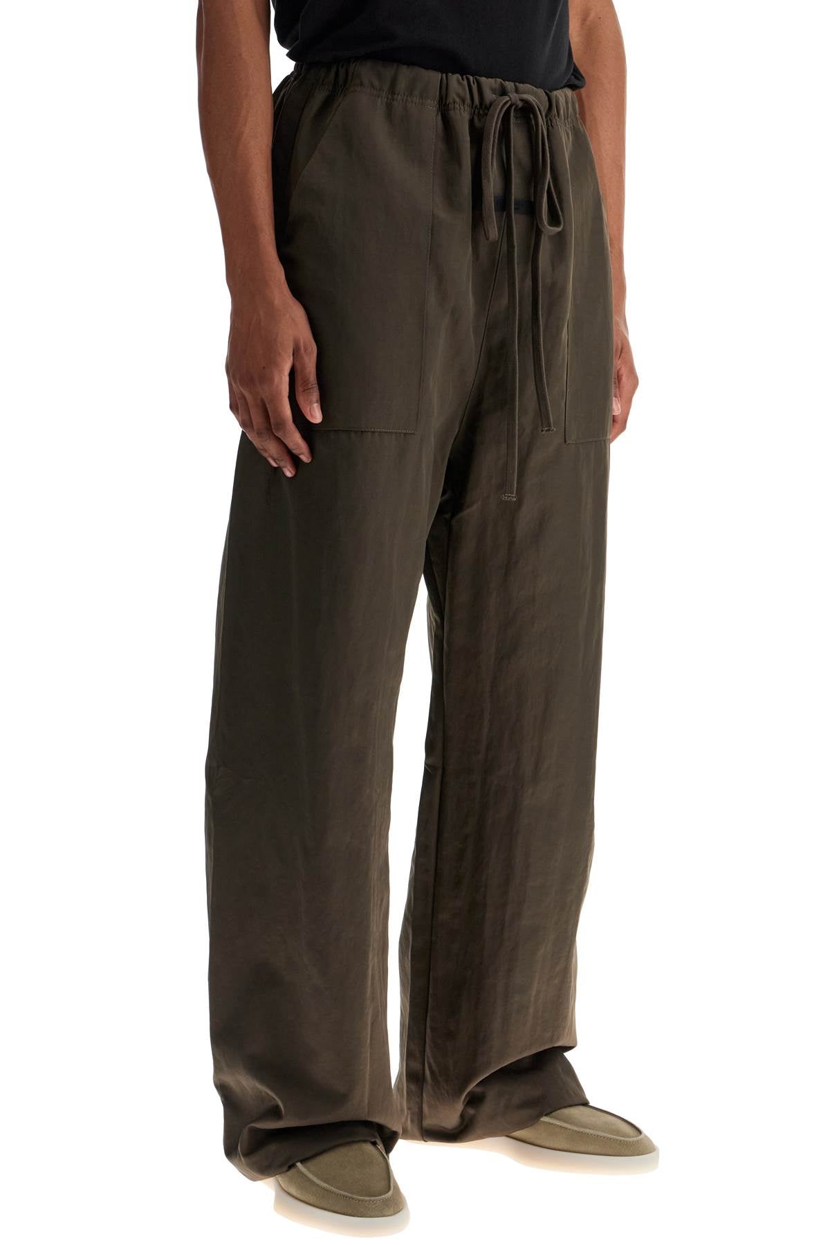 Fear Of God ESSENTIALS textured nylon utility pants for versatile image 1