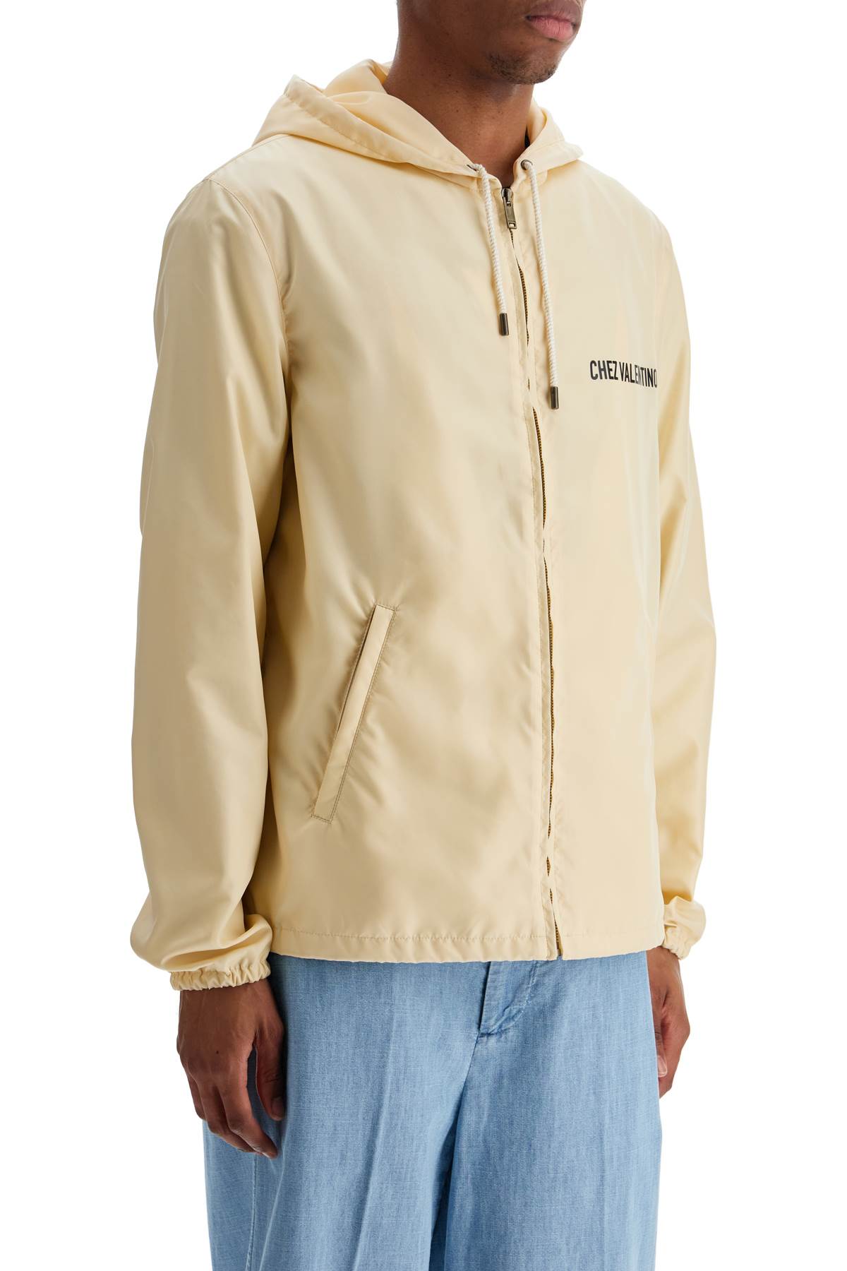 Valentino Garavani beige hooded windbreaker in logoed polyamide image 1