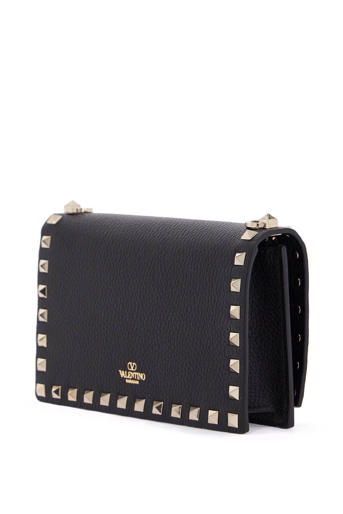 Valentino Garavani mini black leather bag with golden metal studs image 1