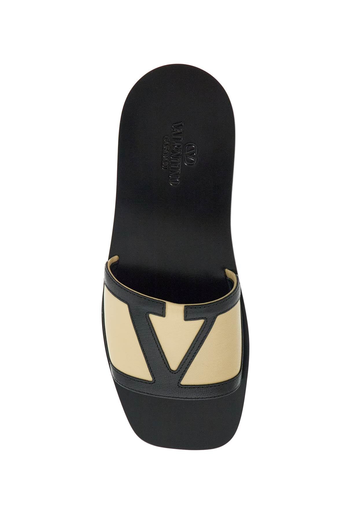 Valentino Garavani men's black and beige goat leather slippers with central strap image 1