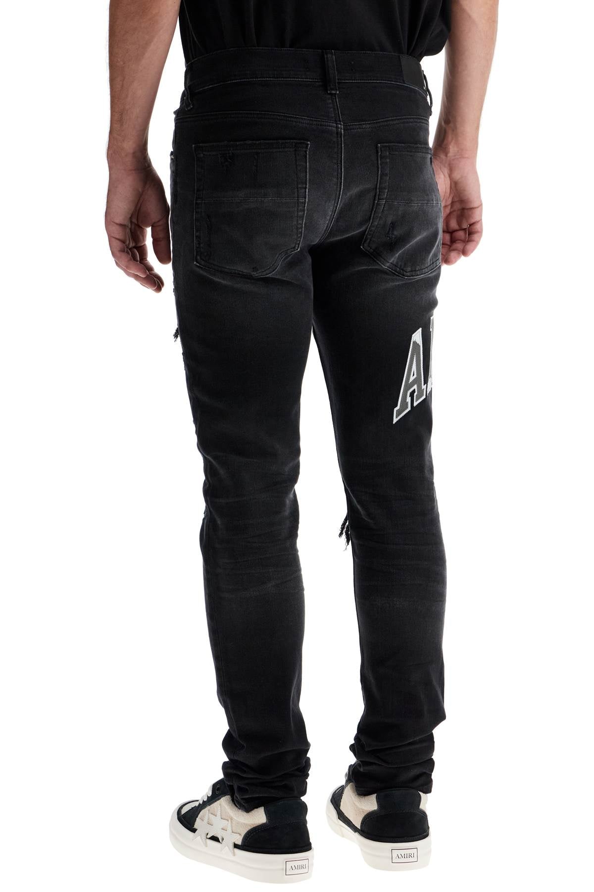 Amiri skinny jeans with varsity logo image 2