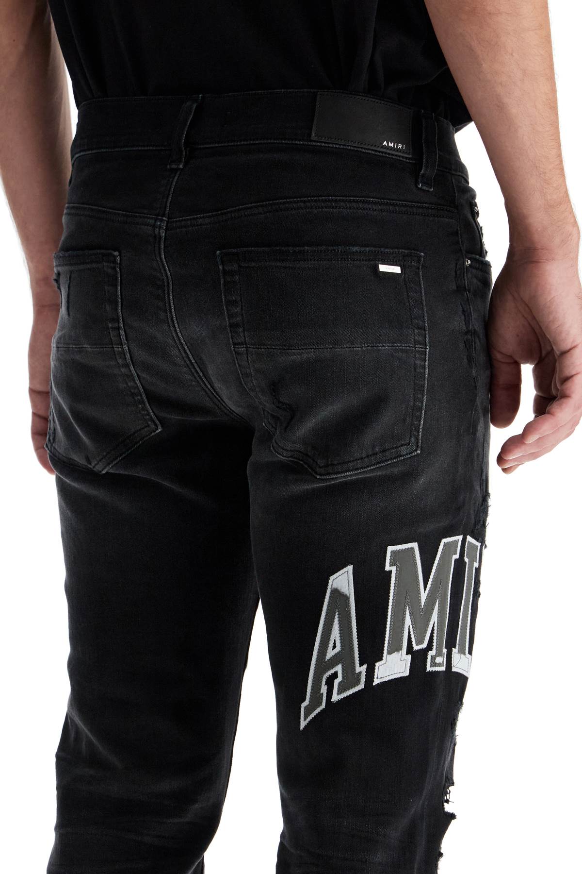 Amiri skinny jeans with varsity logo image 3