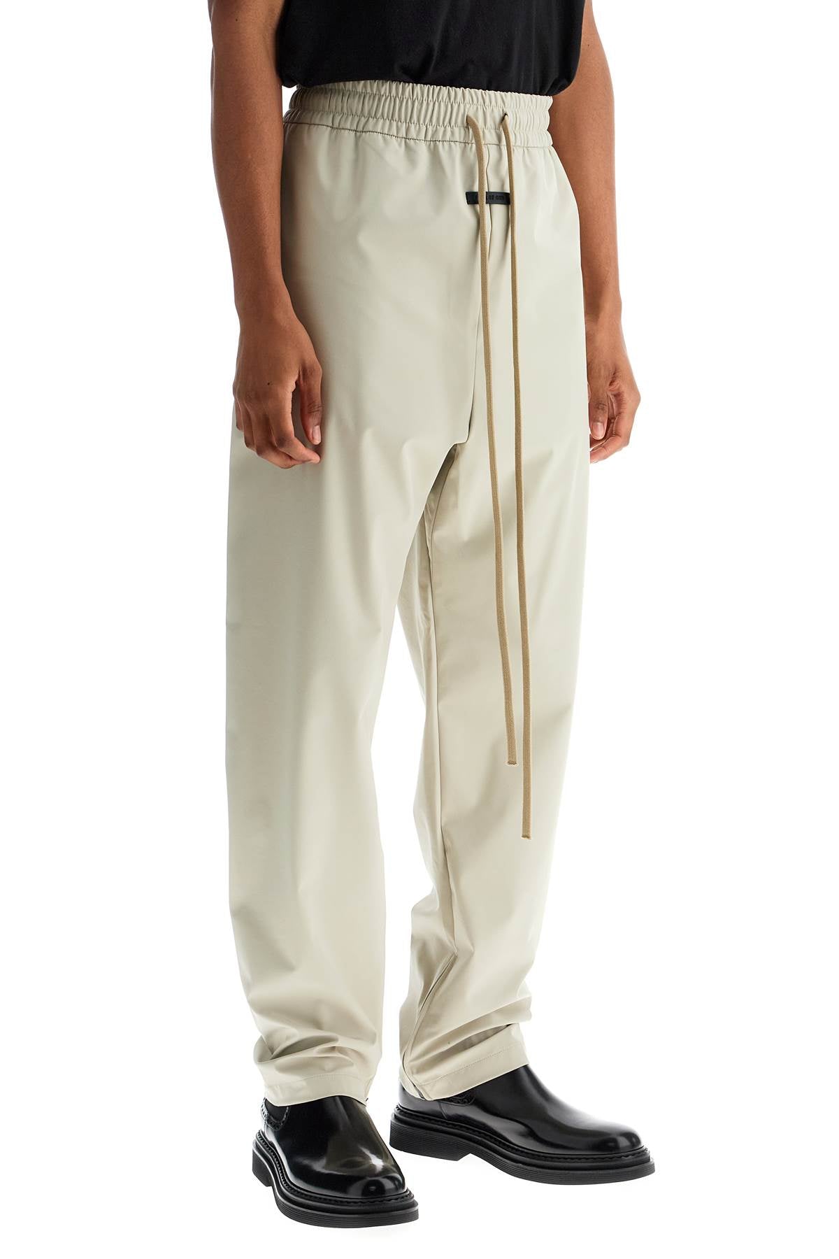 Fear Of God wide leg nylon track pants in cement image 1